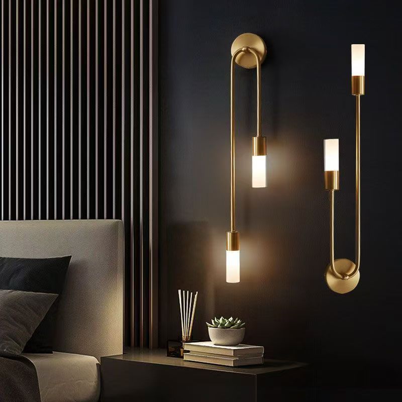 Long bedside wall lamp in the bedroom
